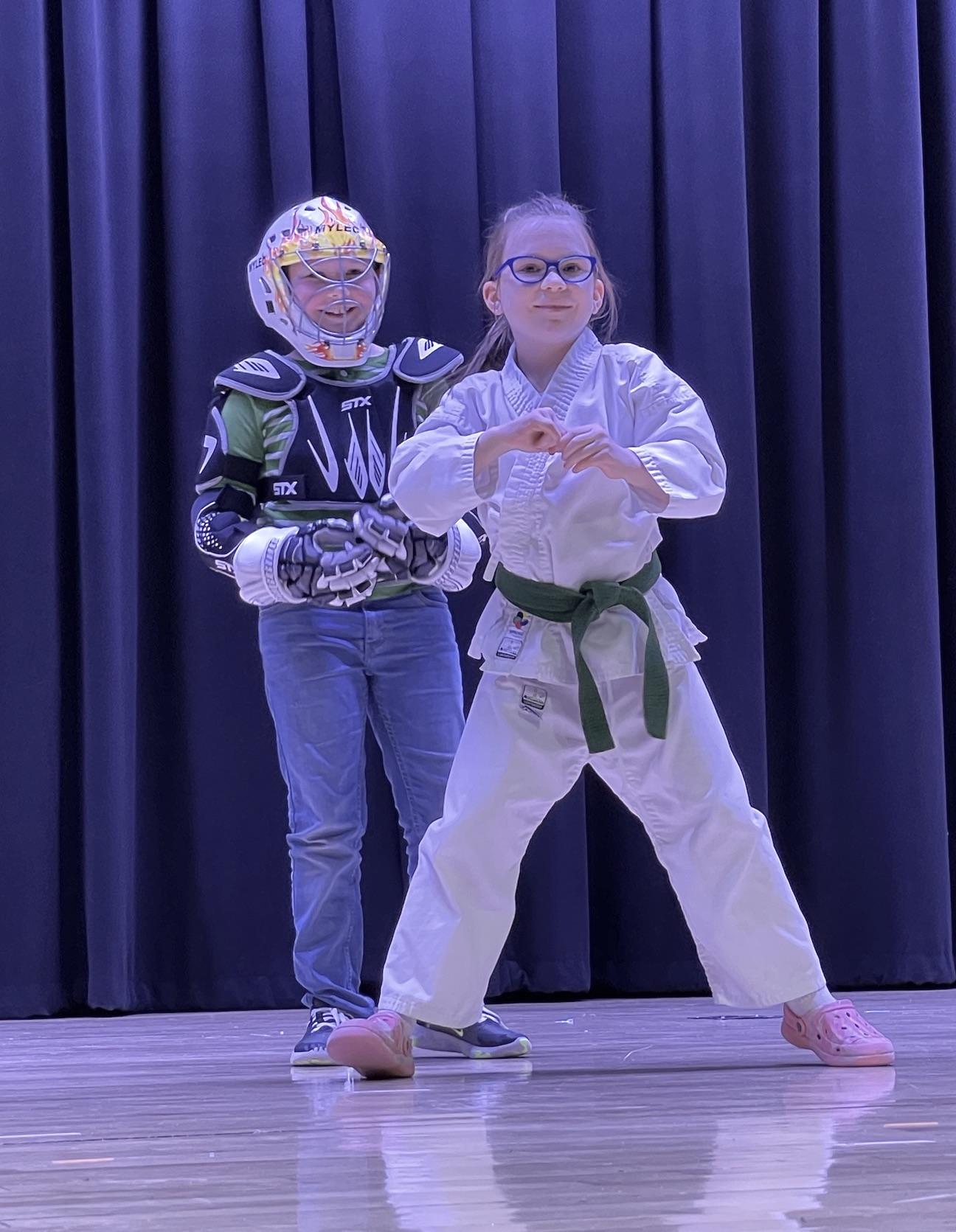 Third-graders Hannah Kelleher and Jackson Carns demonstrate self-defense