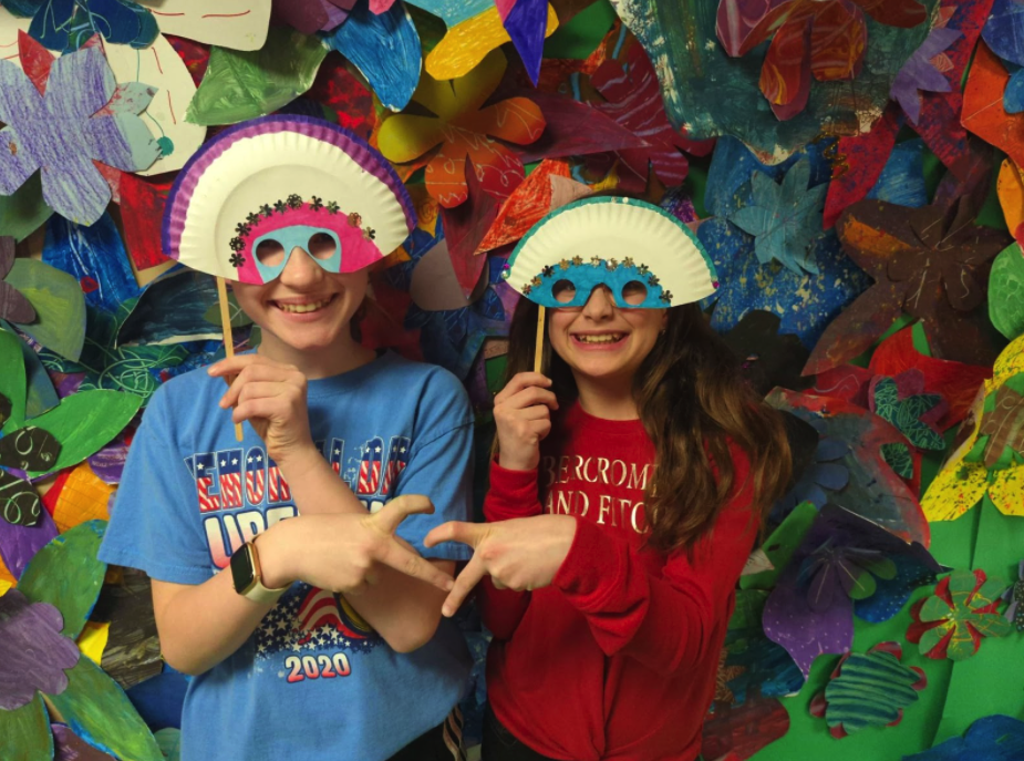 5th graders Kate Welsh and Olivia Potter show off their Mardi Gras masks