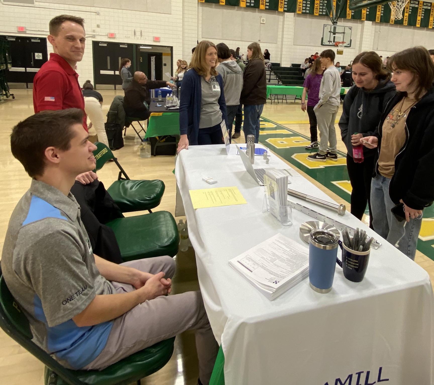 Hammill Manufacturing representatives discuss job shadowing opportunities with students interested in a career in STEM