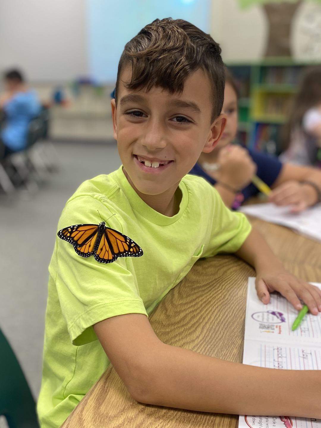 3rd-grader Leo Pasquarelli gets an up-close look at the Monarch butterfly