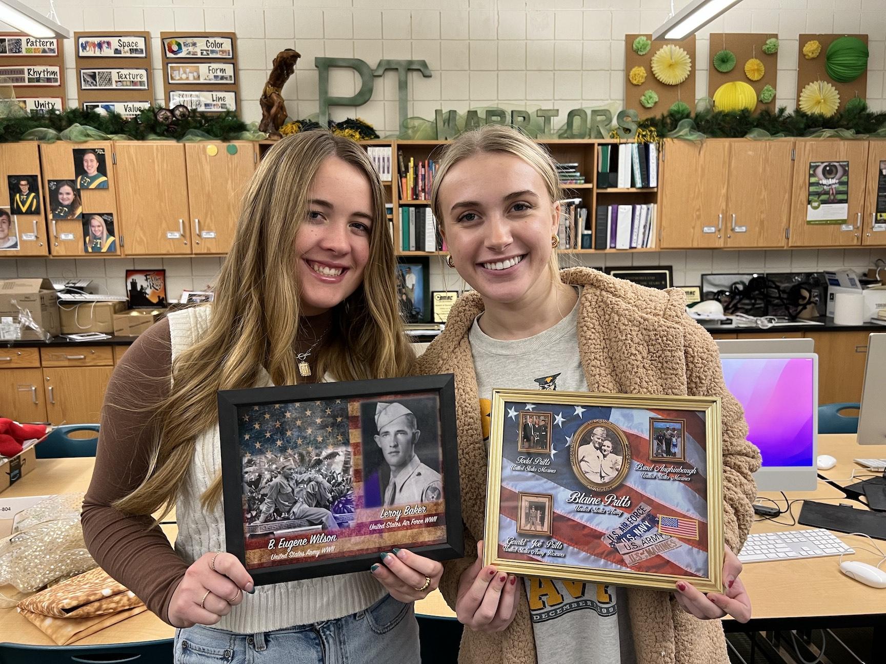 Digital Fine Arts students Maddie Lucas and Maggie Bart display their murals