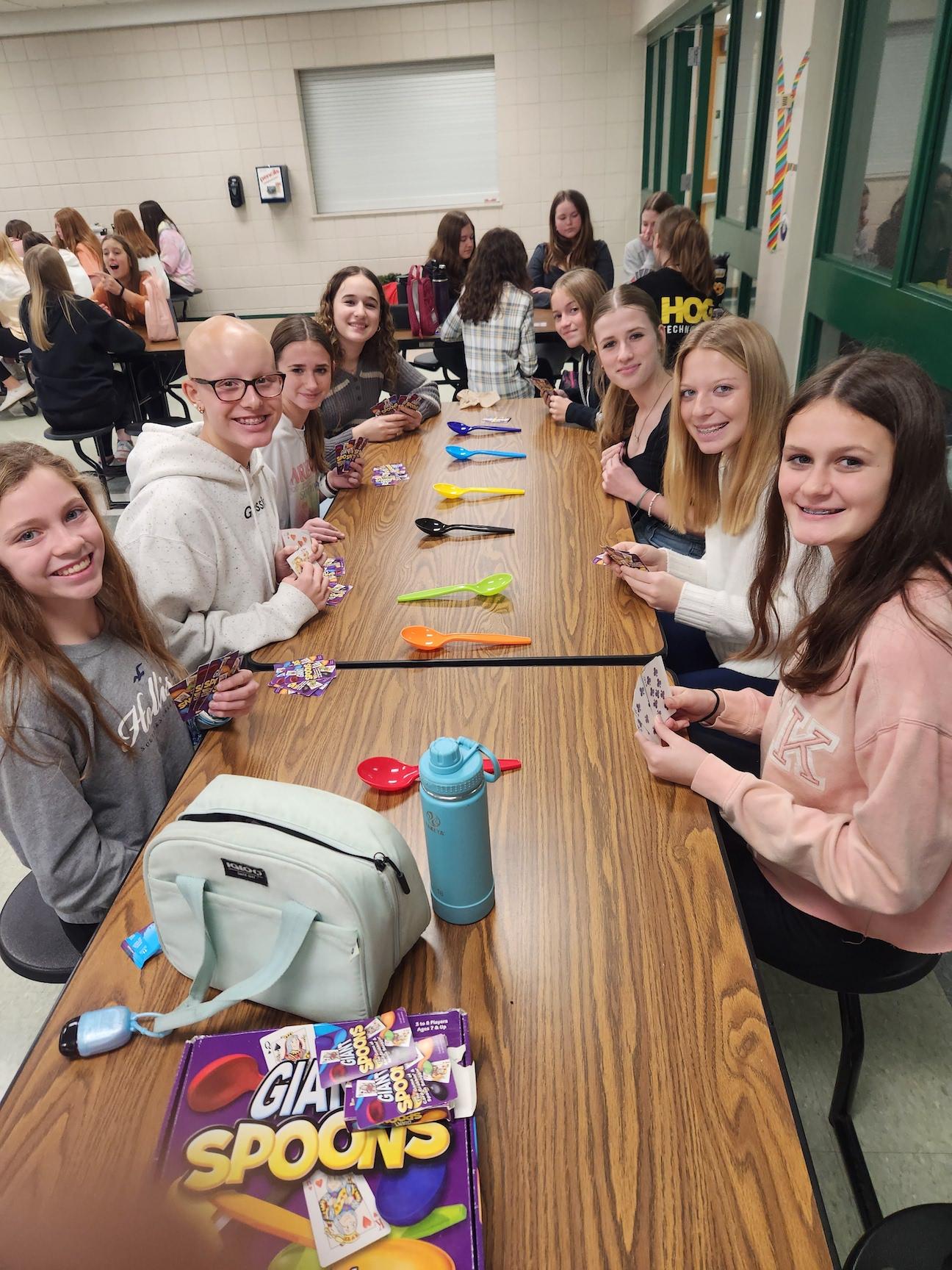 8th-graders enjoy a game of Giant Spoons