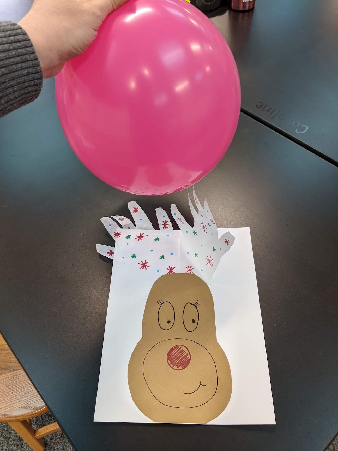 Reindeer’s tissue-paper antlers were attracted by the static electricity of the balloon
