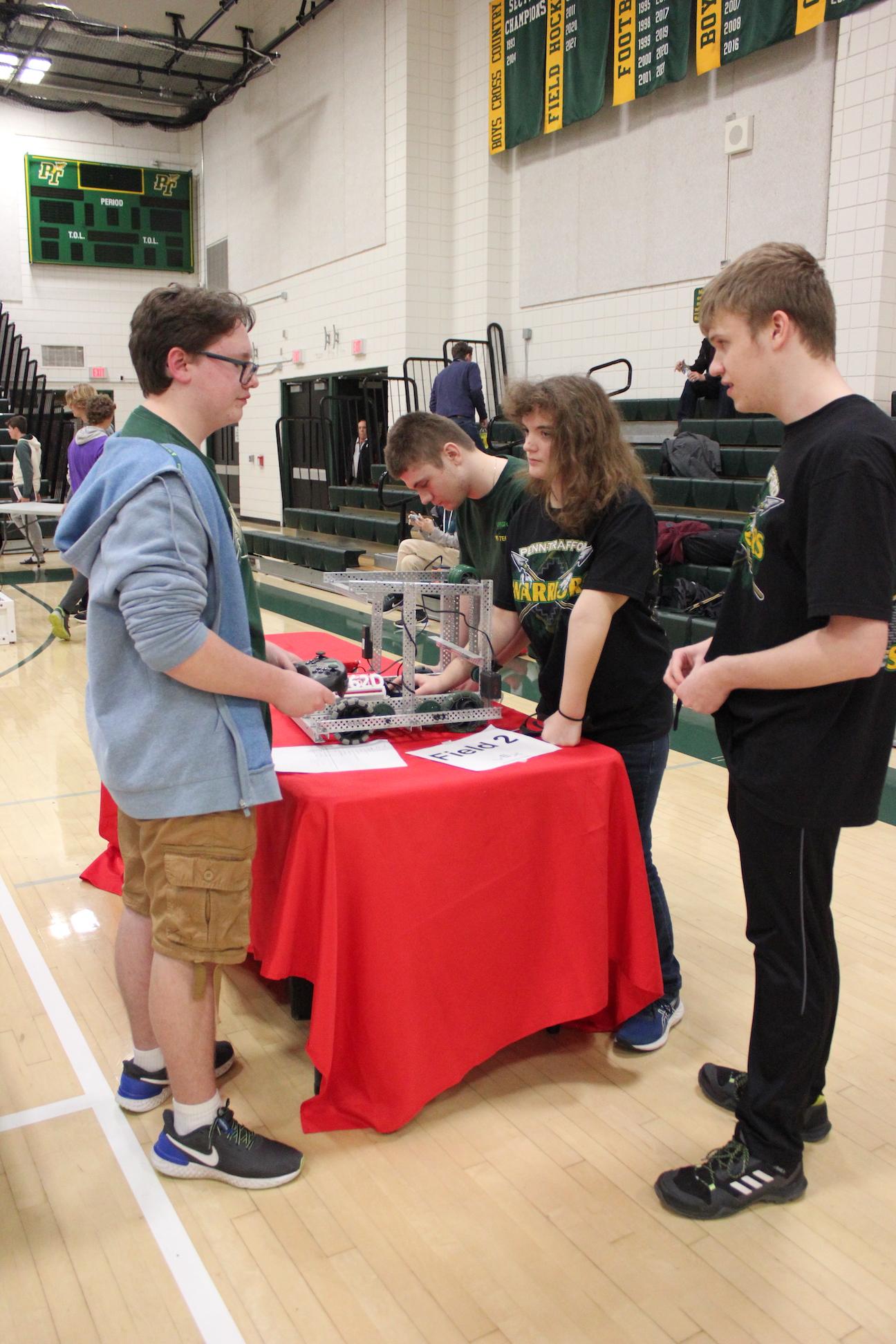 Penn-Trafford team #1462D prepares for a match (Left to right) Frankie Coakley, Brant Urban, Jessica Graham, and Kolin Ditter