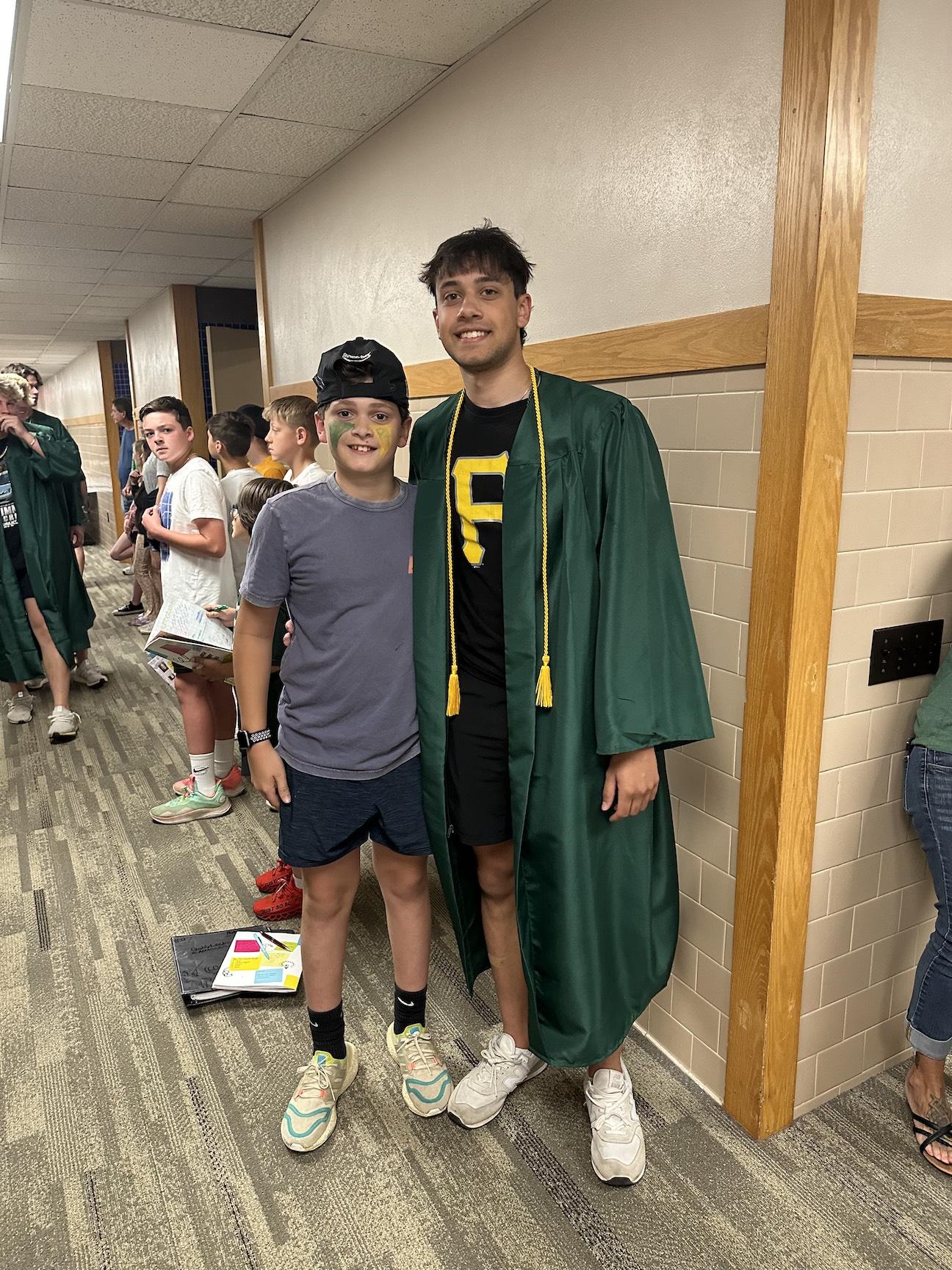 Fifth-grader Nate Goldberg poses with his brother, Josh, at Level Green’s graduation parade