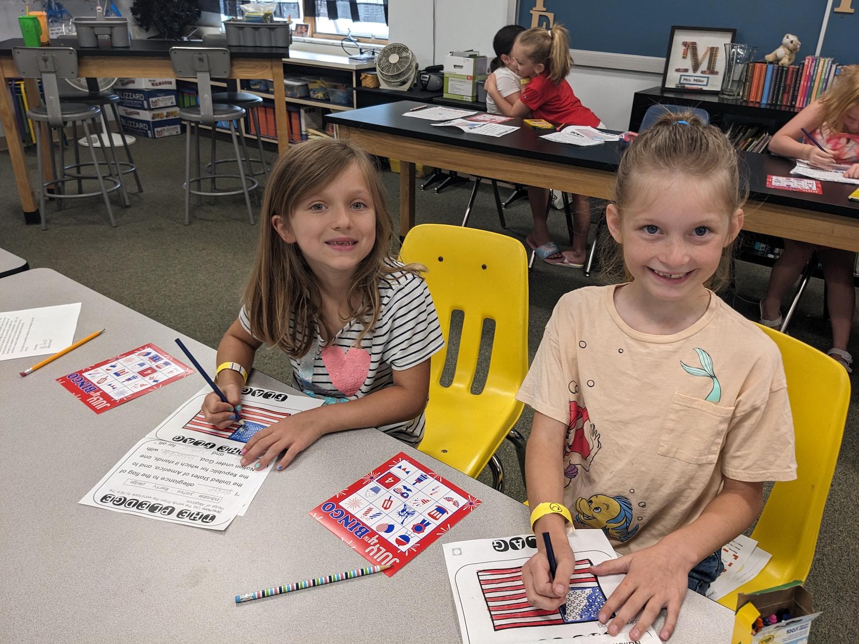 Rising 3rd-graders Madison Kralik and Liliana Roberts learned all about the United States flag