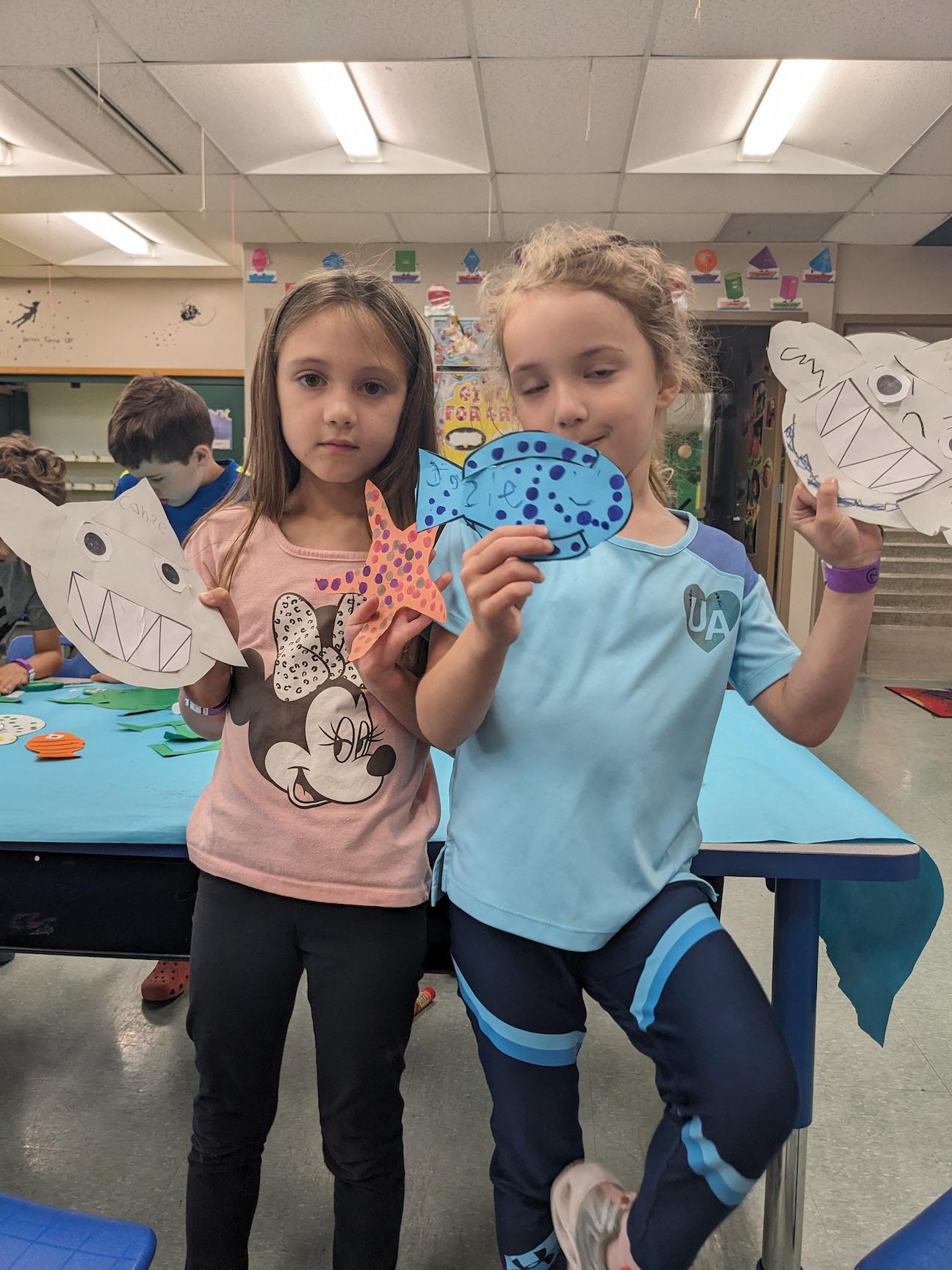 Rising 1st-graders Allie Crawford and Josie Bafile show off their under-the-sea creatures