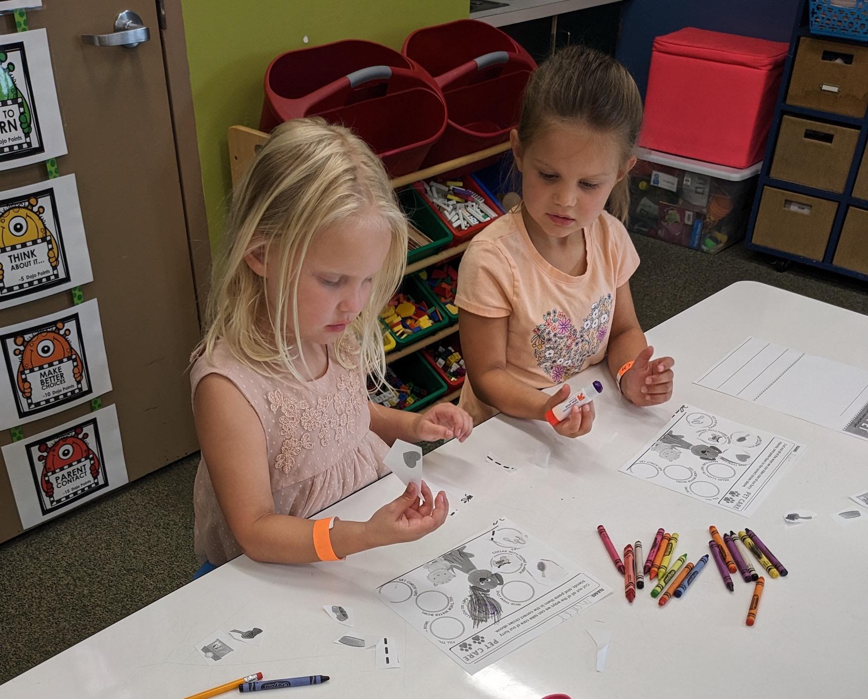 Rising kindergarteners Macky Mae Ekis and Ella Thompson worked together to learn all about pets