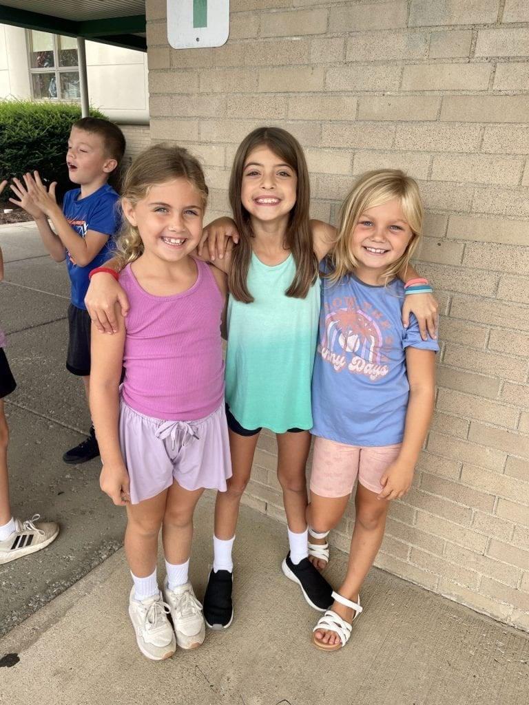 2nd-graders Emsley Dennison, Willow Scavincky, and Amelia Smith wait patiently in line for a Kona Ice treat