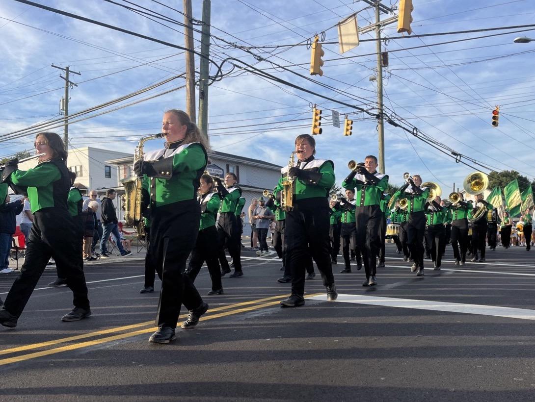 The Penn-Trafford High School Marching Band parades across Route 130 on the route to the high school stadium