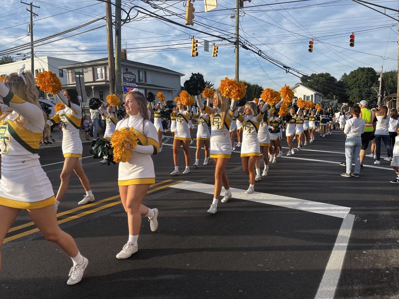 The cheerleaders participated in the parade