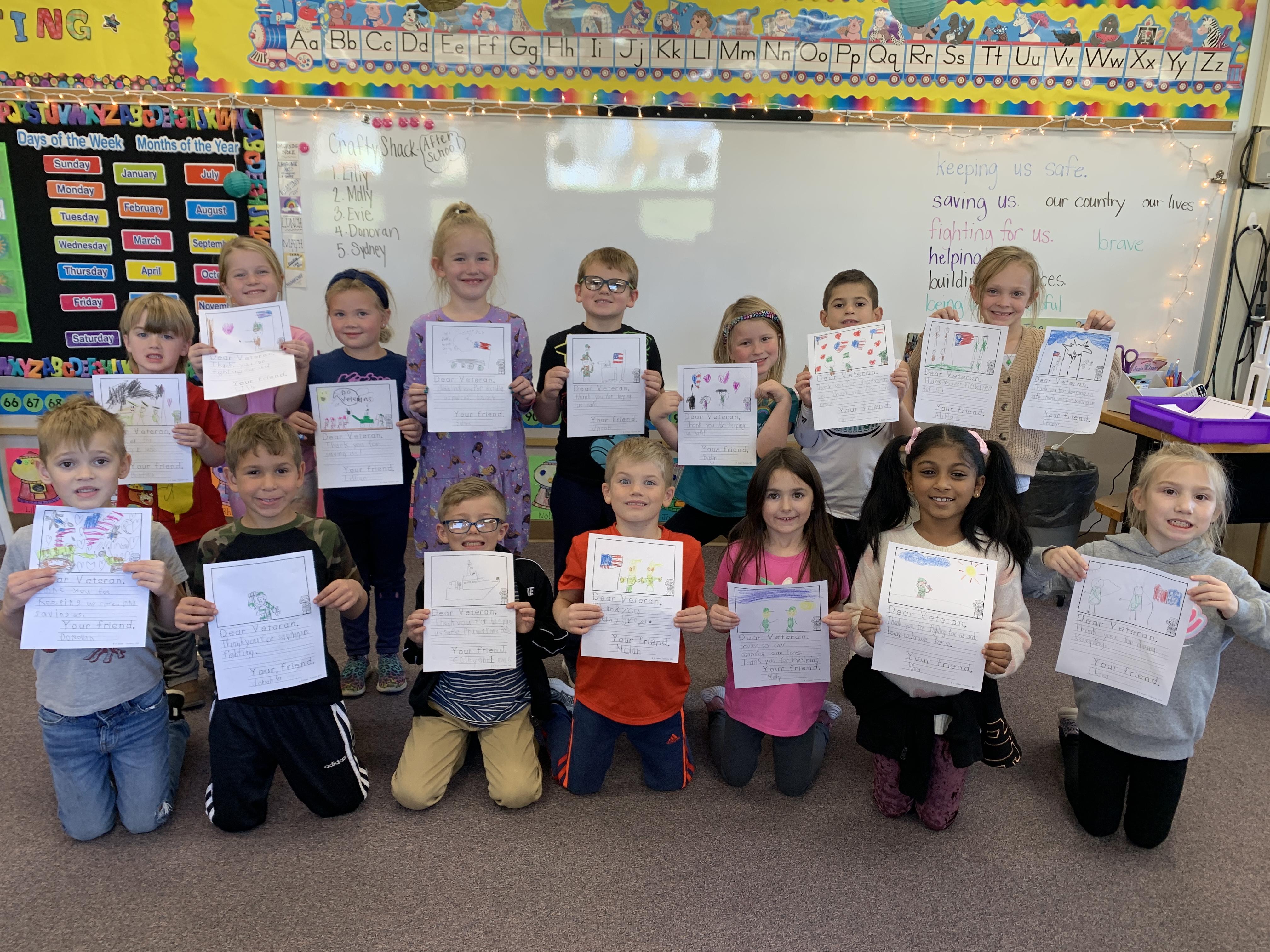 Miss Bozzuto’s class with the letters they wrote to local veterans