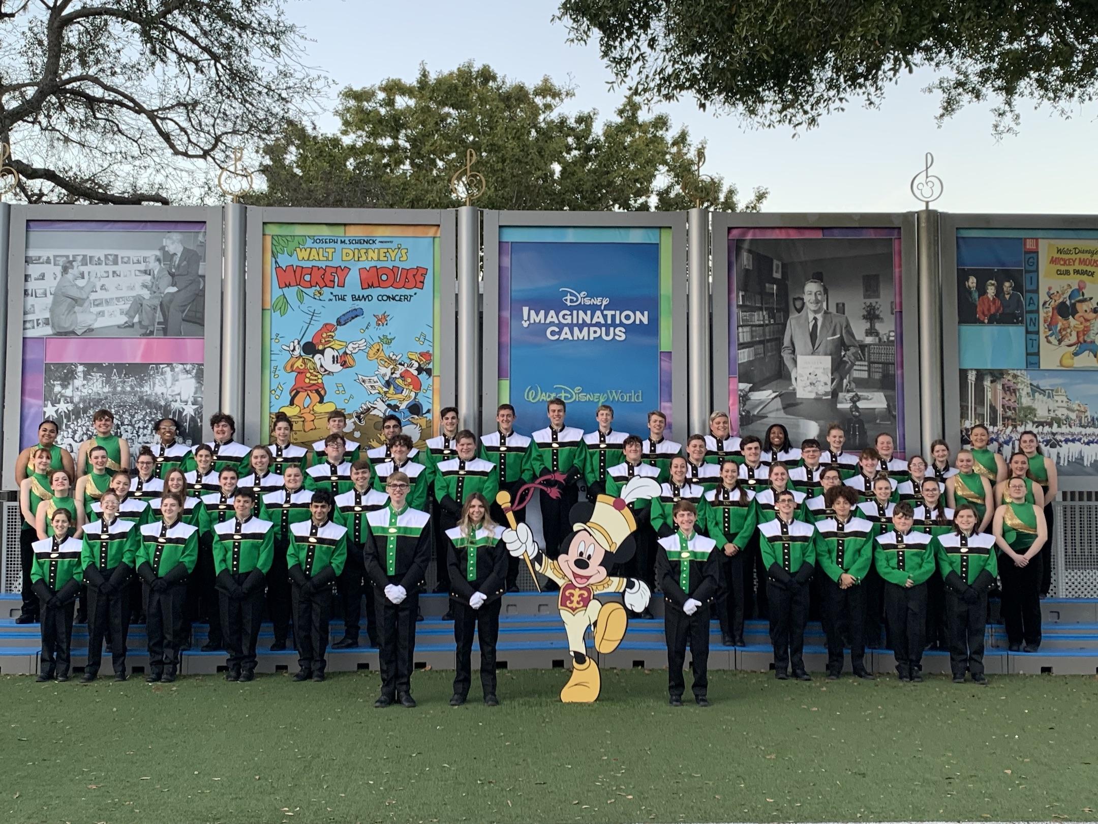 The band poses at Disney World