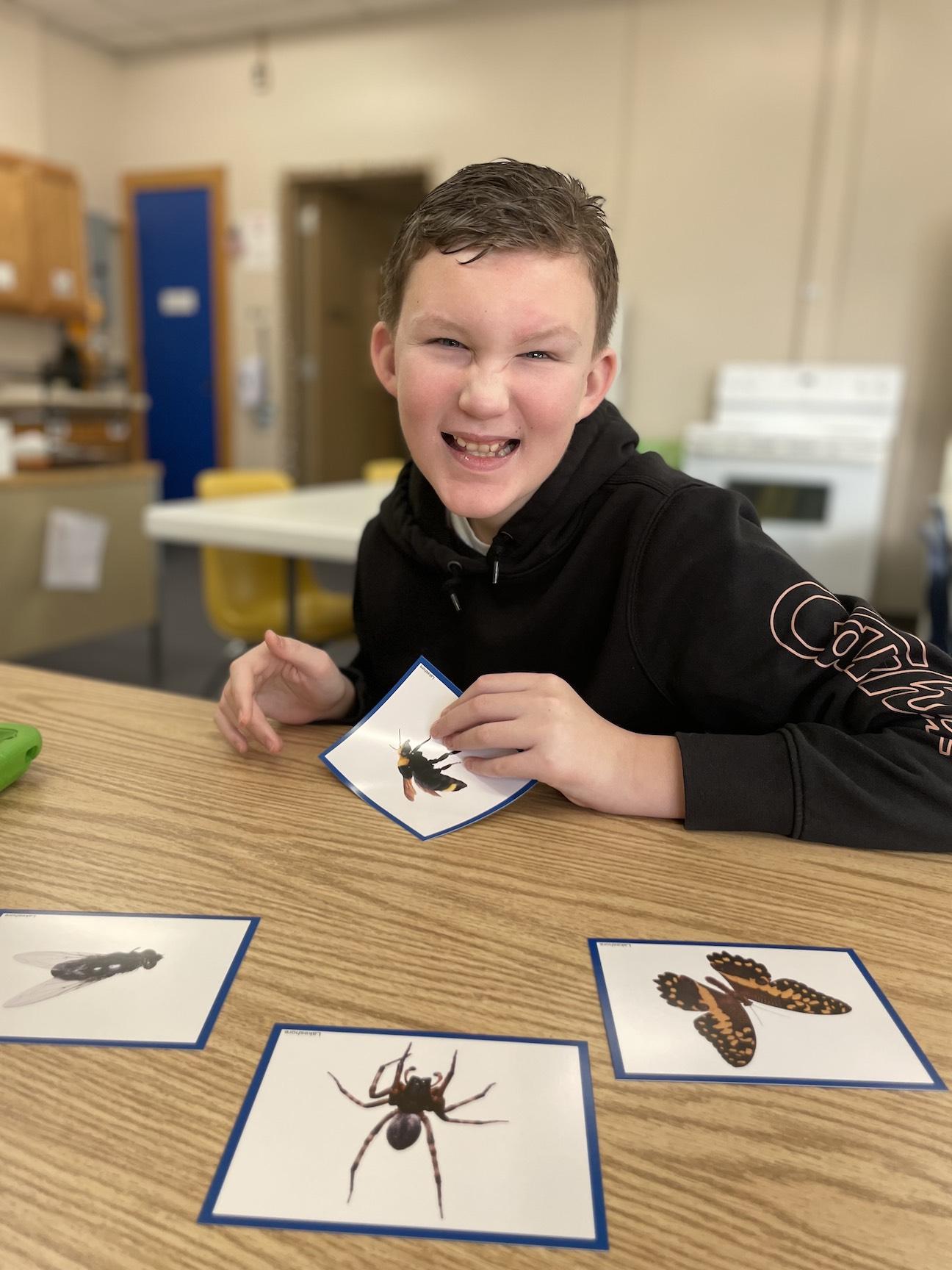 Caad Costelnock practices labeling and learning new facts about objects in the bug category