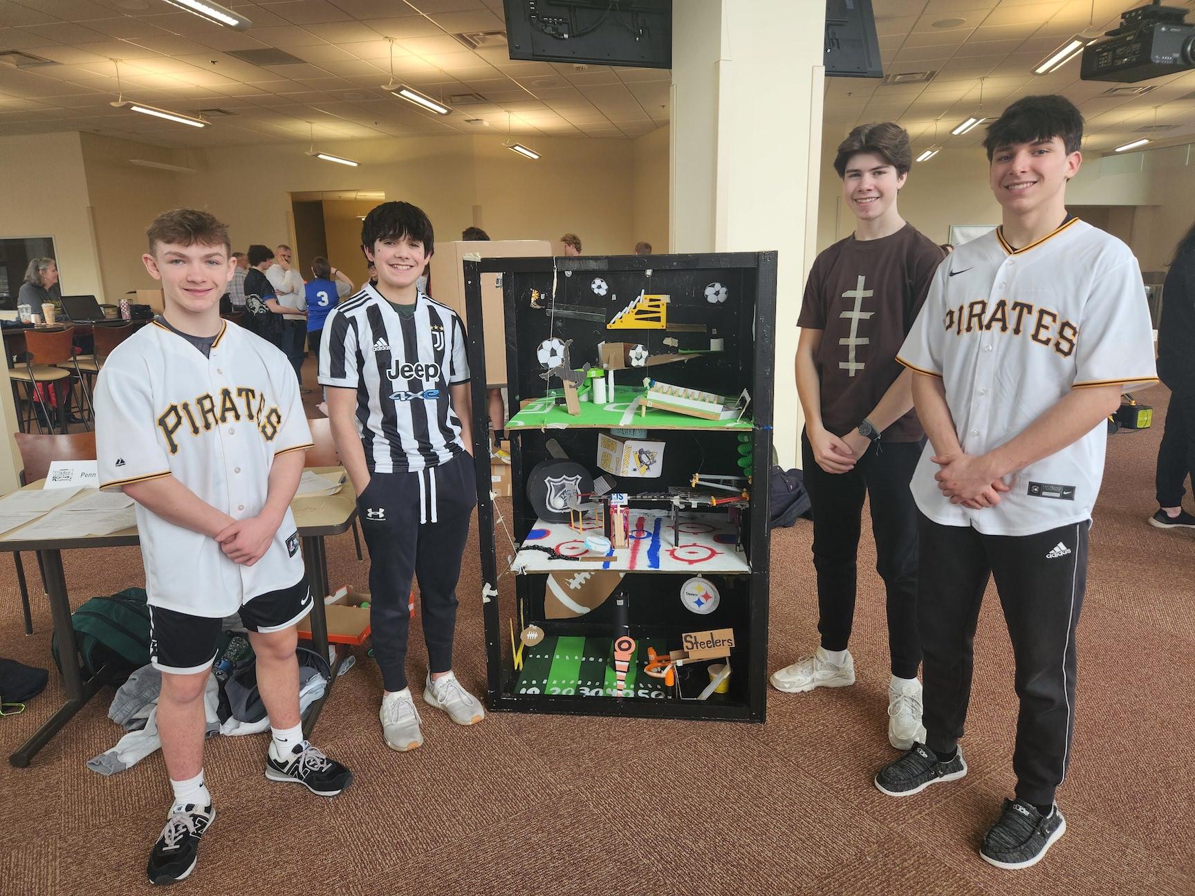 10th-graders Jacob Lang, Evan Sadler, Ethan Goldsworthy and Logan Matrisch with their Pittsburgh Sports machine