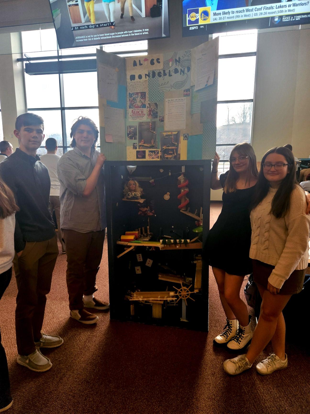 Grant Alexander, Michael Harris, Marissa Fong and Amelia Haslam with their Alice In Wonderland machine
